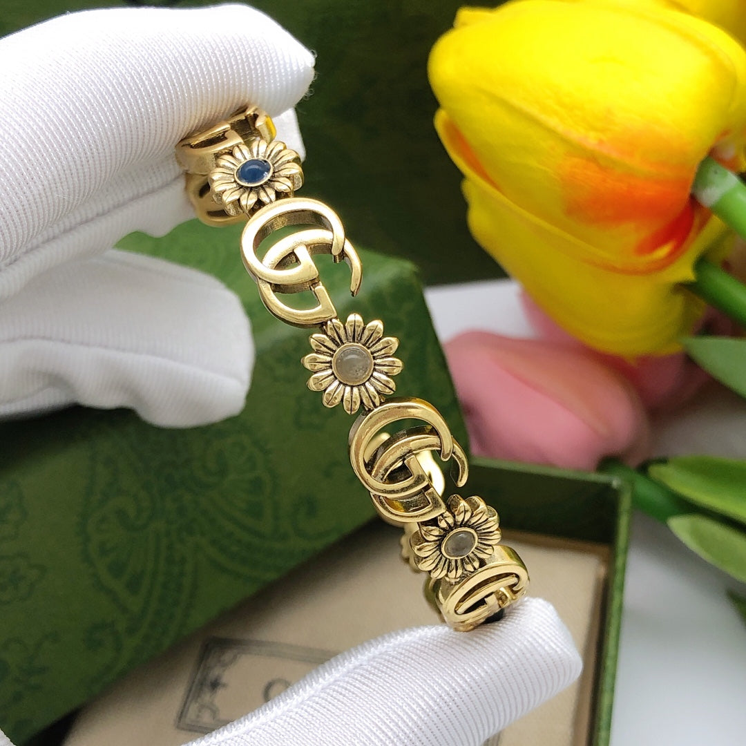 Floral Bangle in Polished Metal-Tone detail view