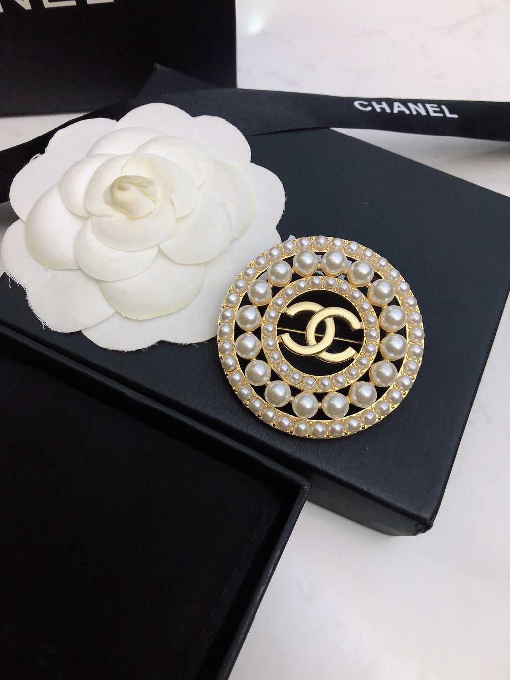 Signature Emblem Brooch in Polished Metal-Tone – Design 035 close-up detail