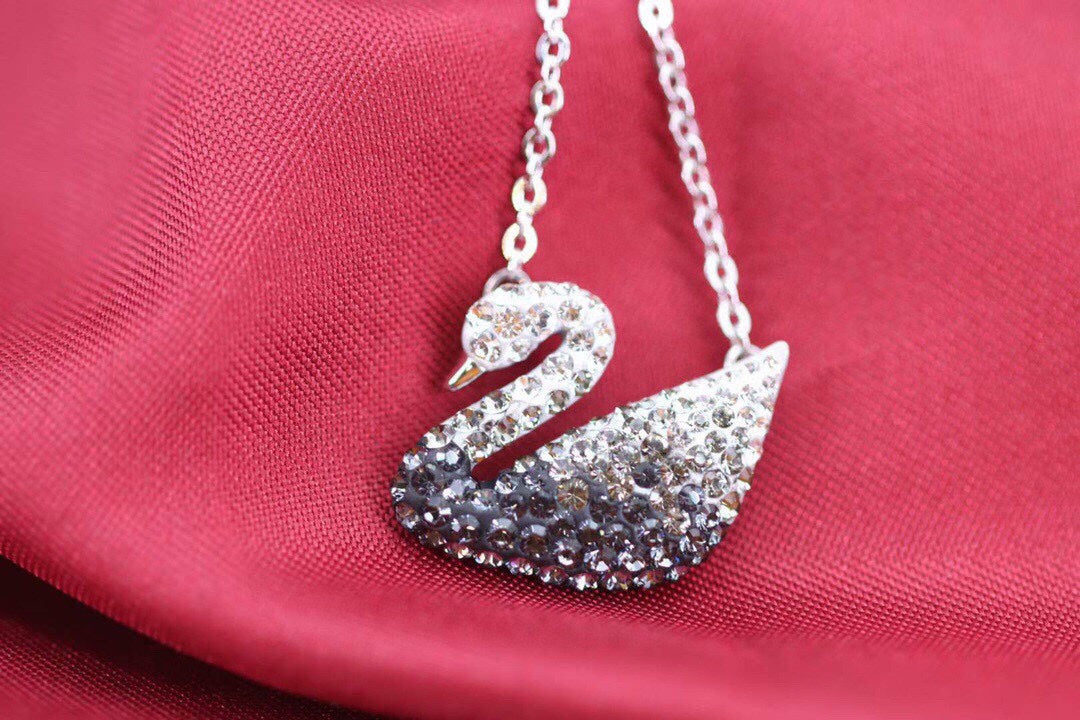 Swan Pendant Necklace in Gold-Tone – Black Detail detail view
