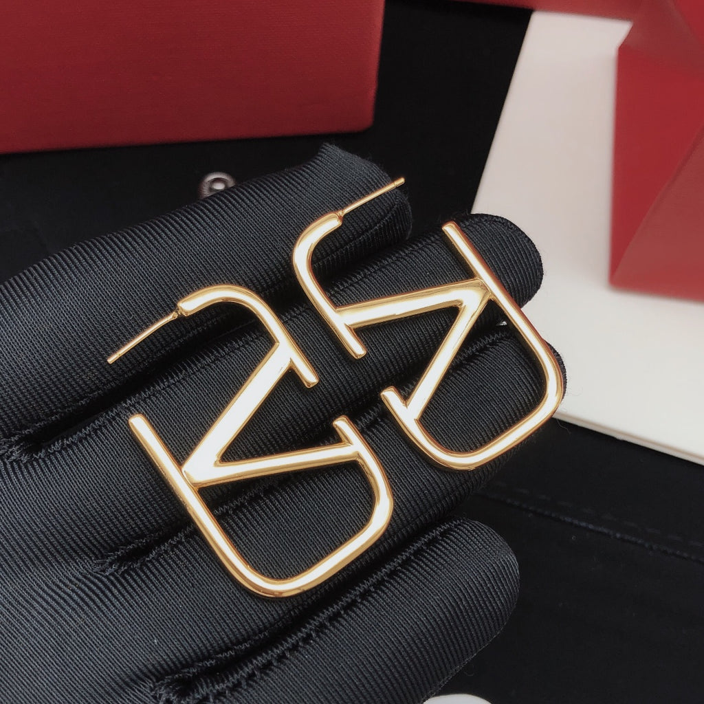Signature Emblem Polished Stud Earrings – Medium front view