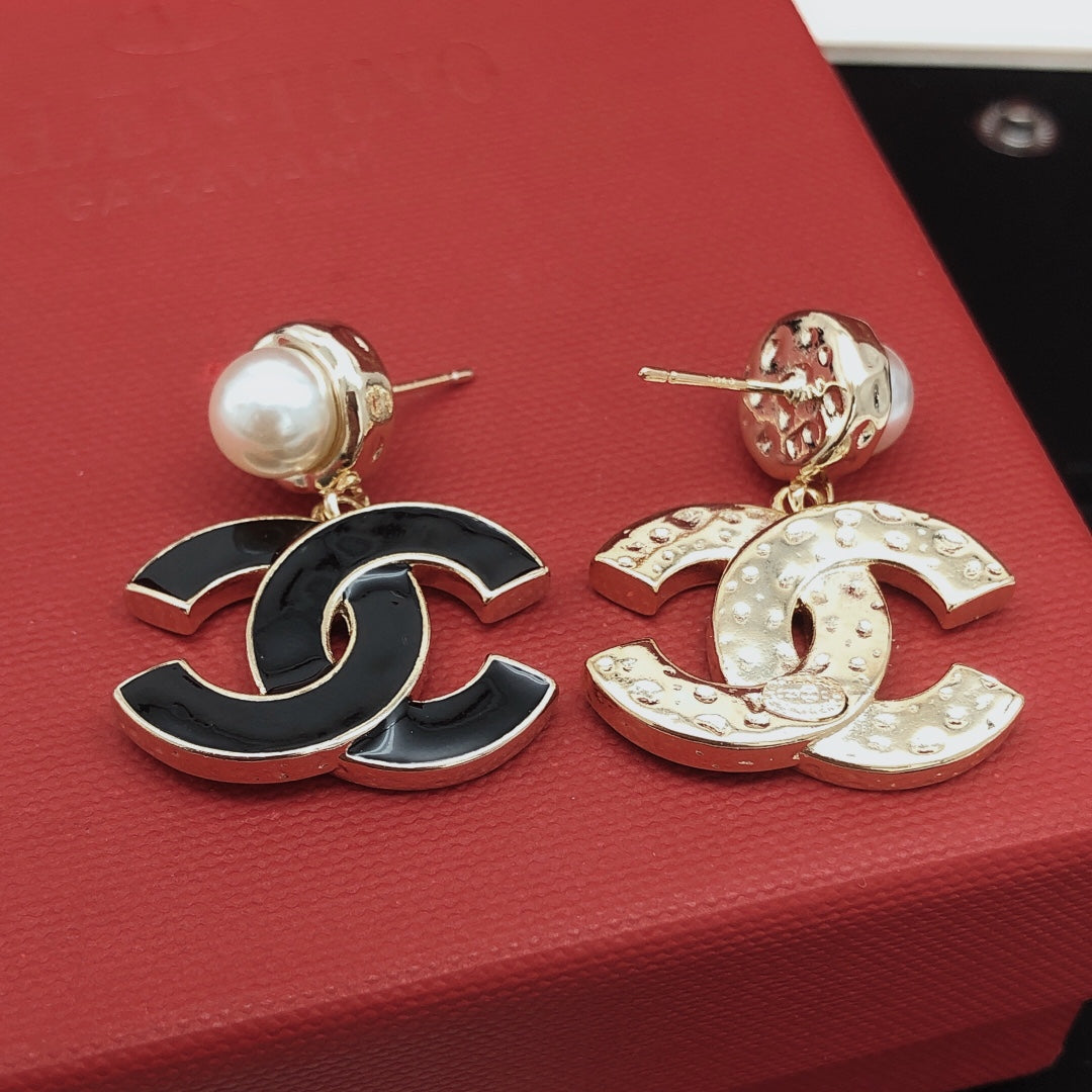 Signature Emblem Stud Earrings in Gold-Tone – Black Detail front product view