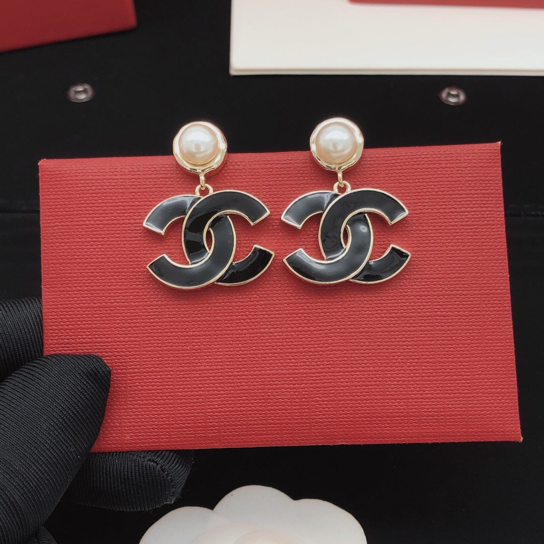 Signature Emblem Stud Earrings in Gold-Tone – Black Detail front product view