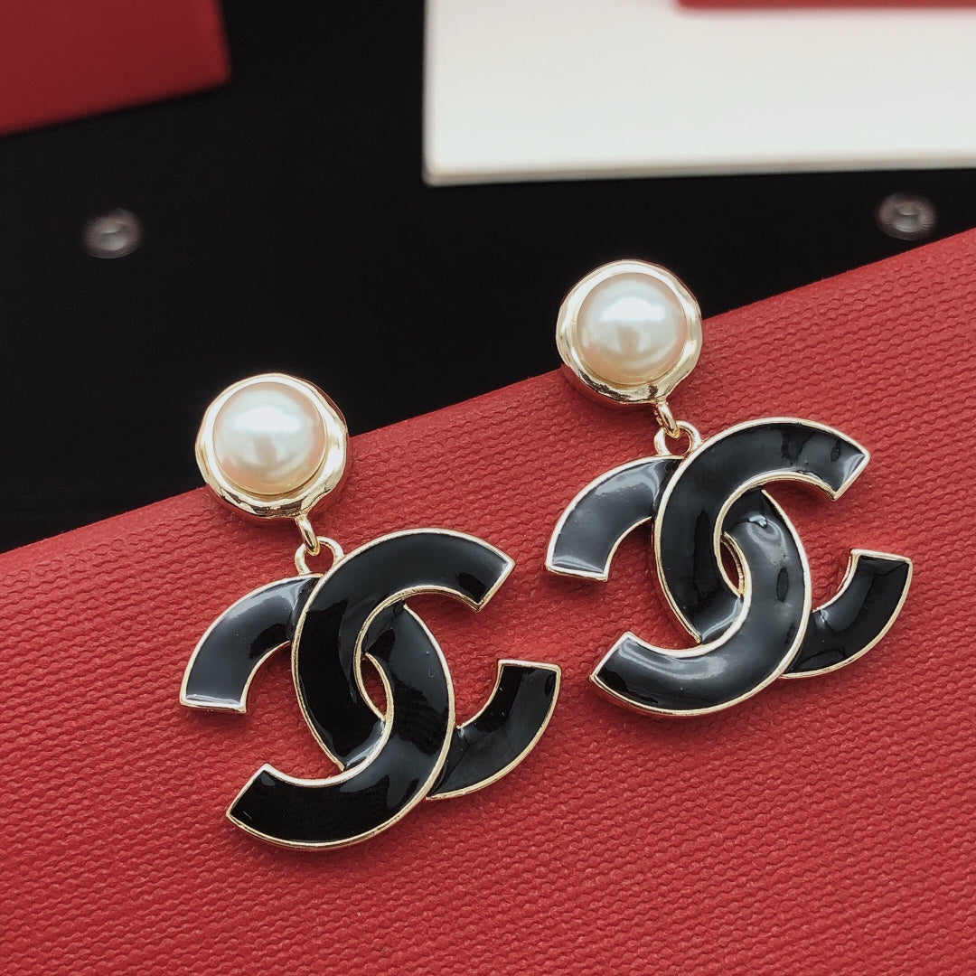 Signature Emblem Stud Earrings in Gold-Tone – Black Detail main product view