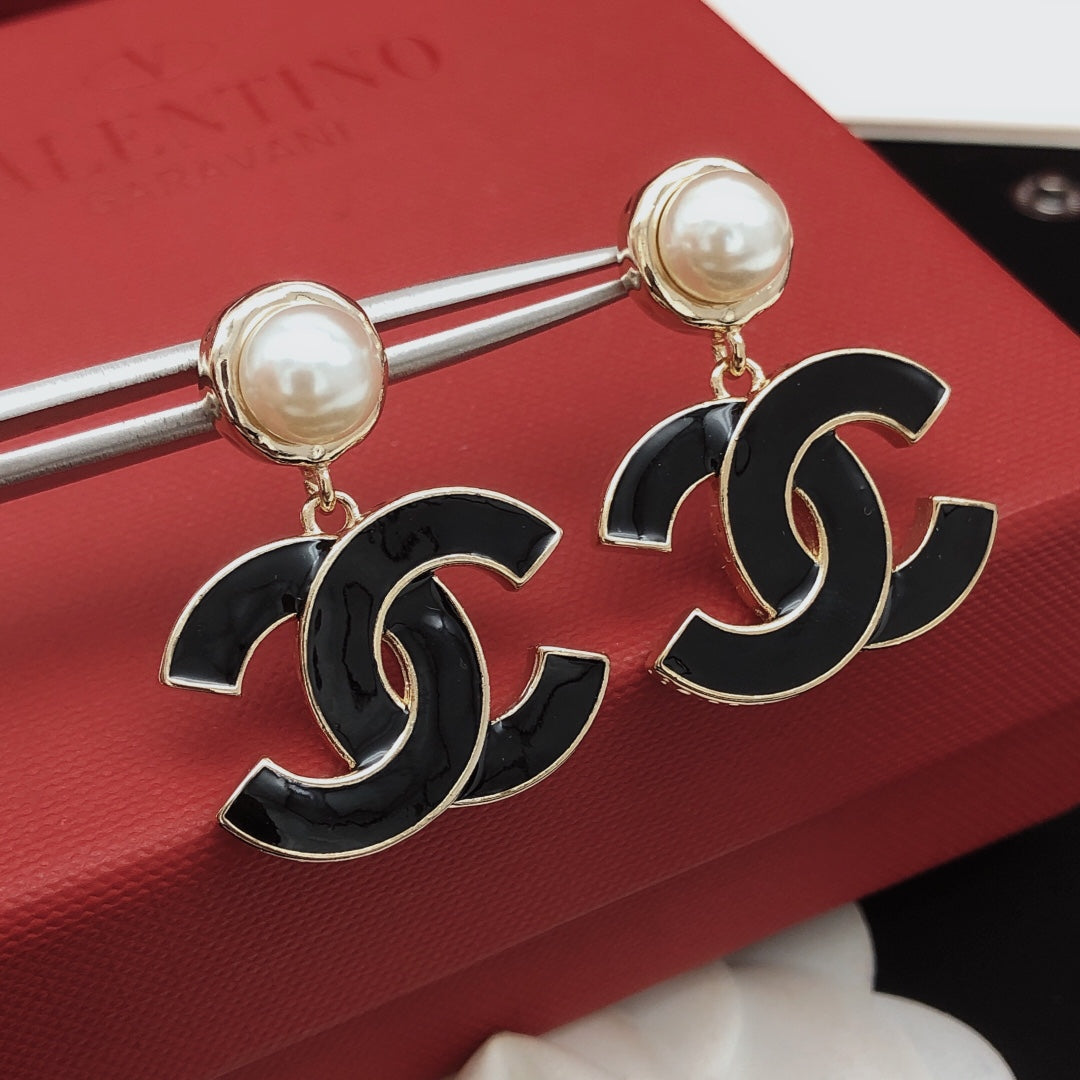 Signature Emblem Stud Earrings in Gold-Tone – Black Detail close-up detail