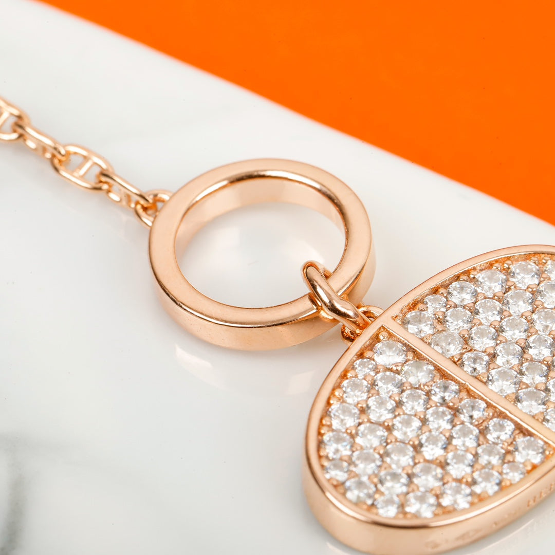 Signature Emblem Bangle in Gold-Tone – Red Detail front product view