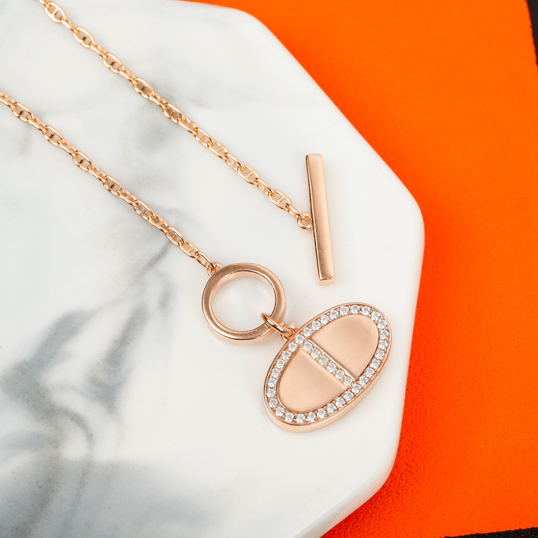 Signature Emblem Bangle in Gold-Tone – Red Detail styled product view