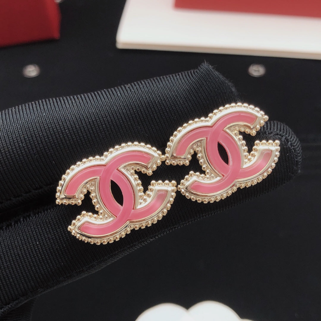 Double-C Emblem Stud Earrings in Gold-Tone – Pink Detail close-up detail