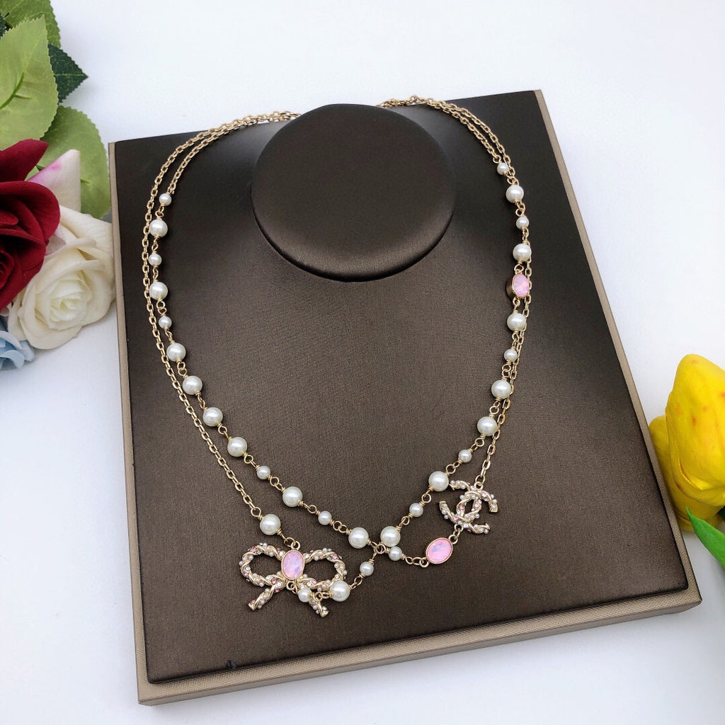 Bow Pearl-Detail Pendant Necklace – Pearl Detail – Design 009 styled product view