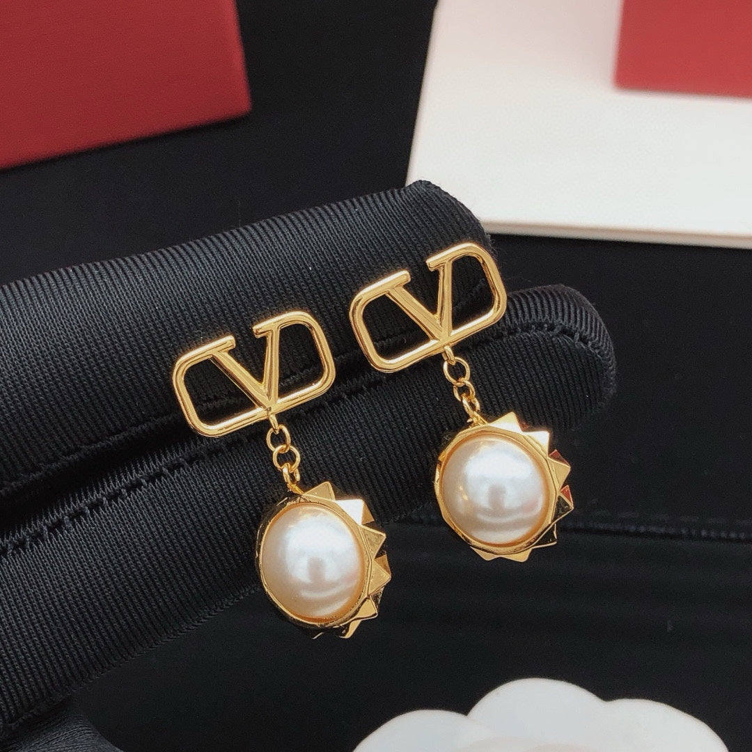 Signature Emblem Pearl-Detail Stud Earrings – Design 02 close-up view