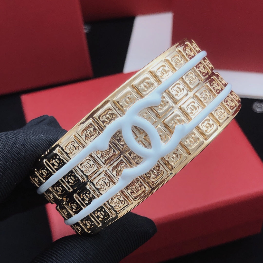 Signature Emblem Bangle in Gold-Tone – White Detail detail view