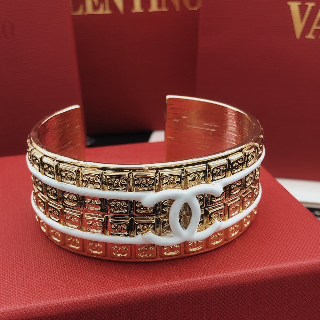 Signature Emblem Bangle in Gold-Tone – White Detail front product view