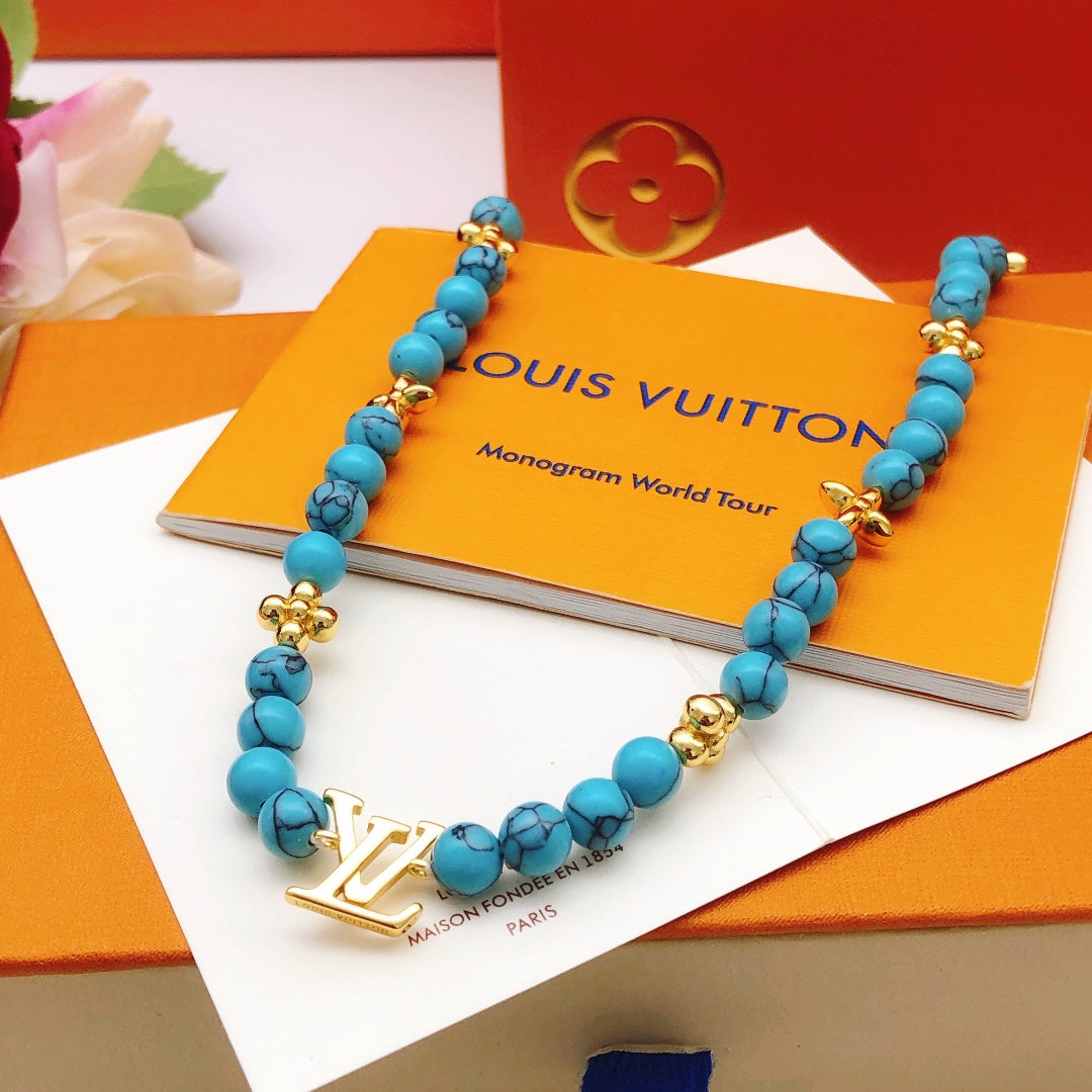 Geometric Emblem Pendant Necklace in Gold-Tone – Blue Detail – Design 007 front product view