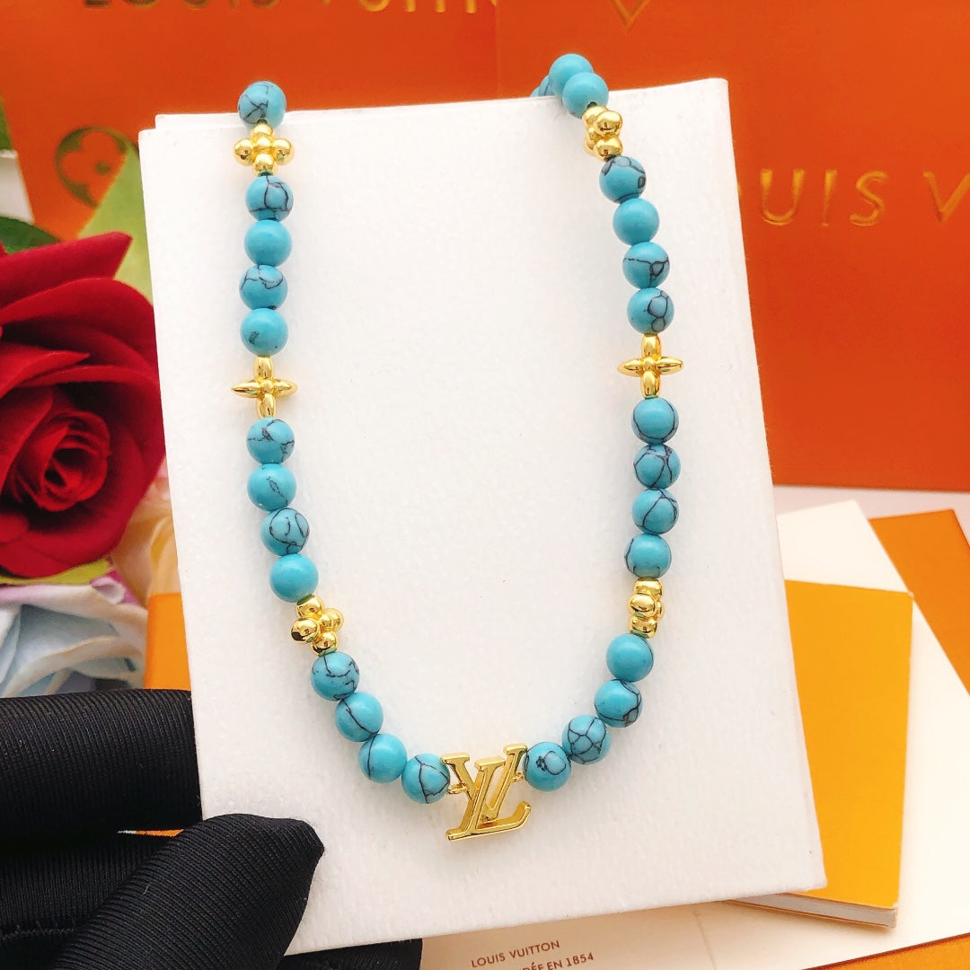 Geometric Emblem Pendant Necklace in Gold-Tone – Blue Detail – Design 007 side detail