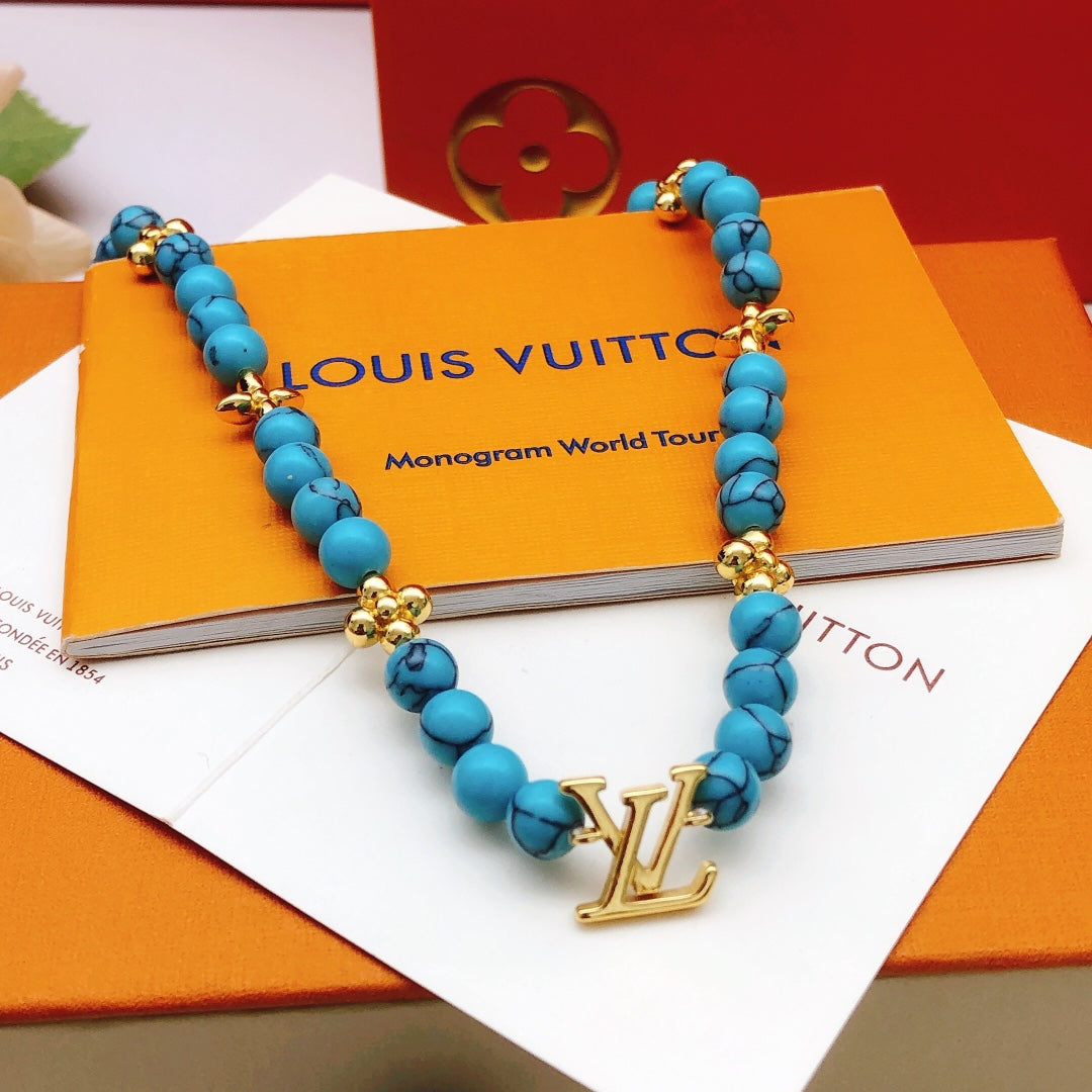 Geometric Emblem Pendant Necklace in Gold-Tone – Blue Detail – Design 007 main product view
