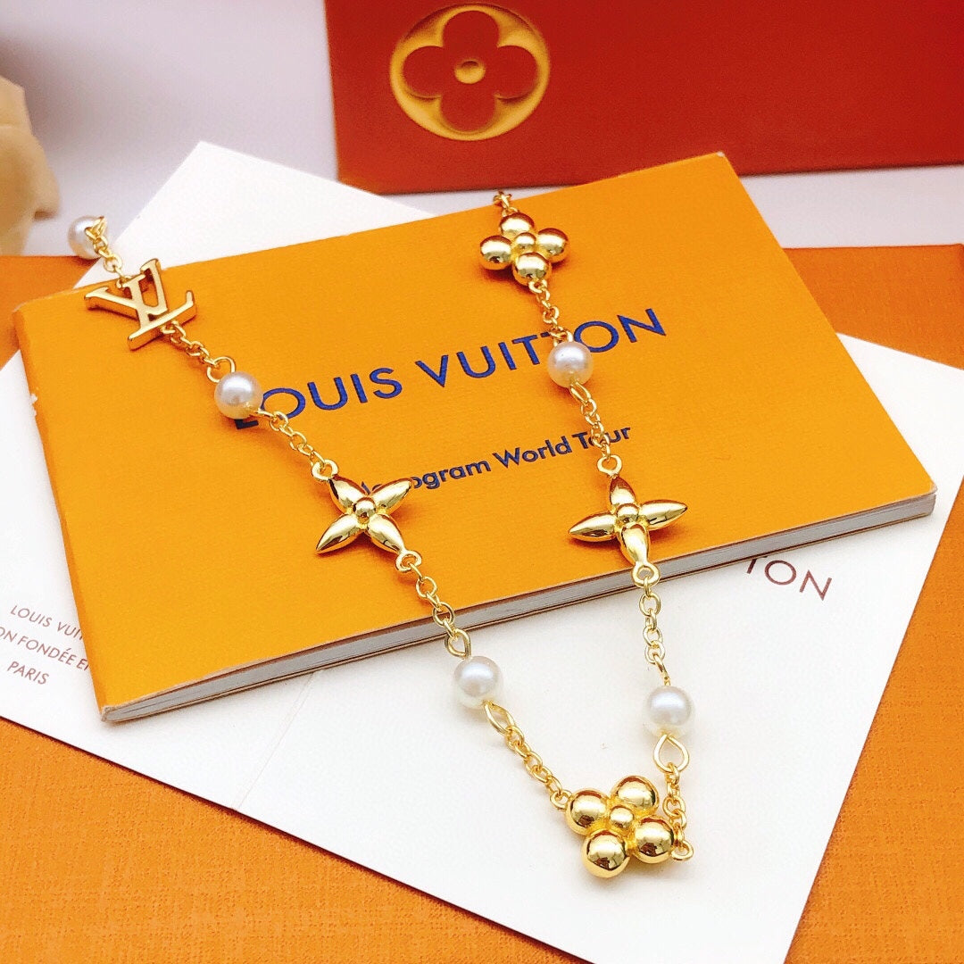 Floral Pendant Necklace in Gold-Tone – Pearl Detail detail view