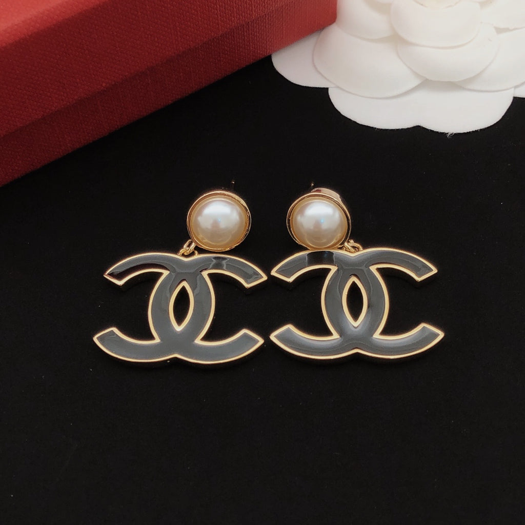 Signature Emblem Stud Earrings in Gold-Tone – Black Detail – Design 002 detail view