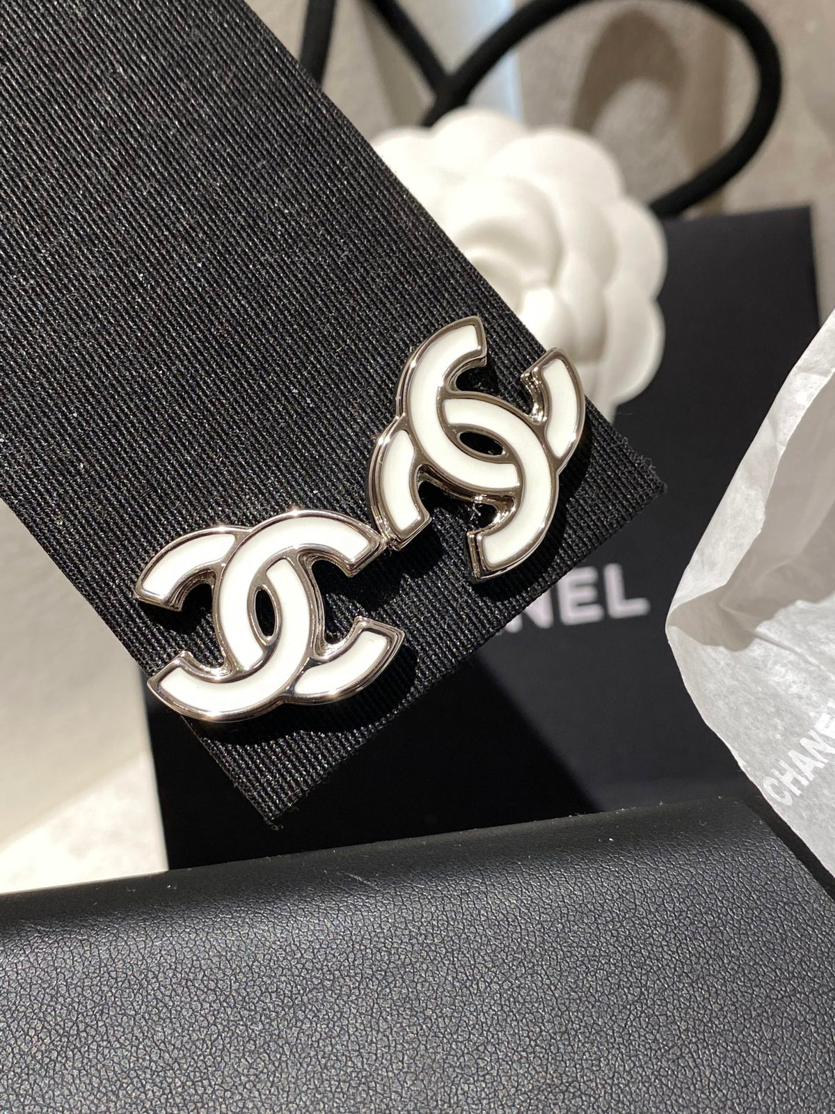 Double-C Emblem Stud Earrings in Polished Metal-Tone – White Detail – Design 004 styled product view