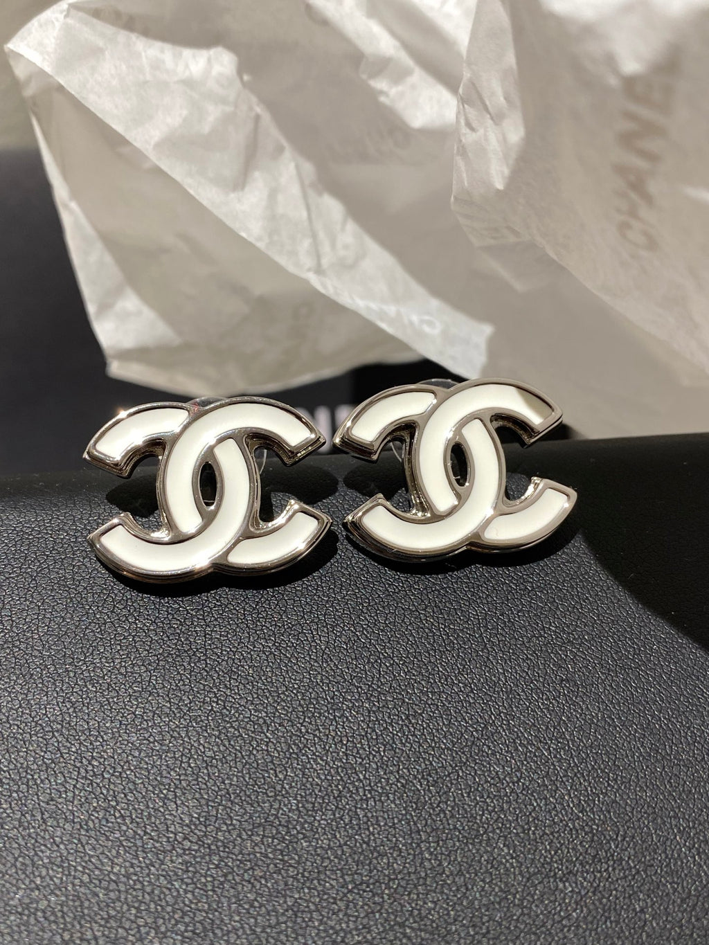 Double-C Emblem Stud Earrings in Polished Metal-Tone – White Detail – Design 004 front product view