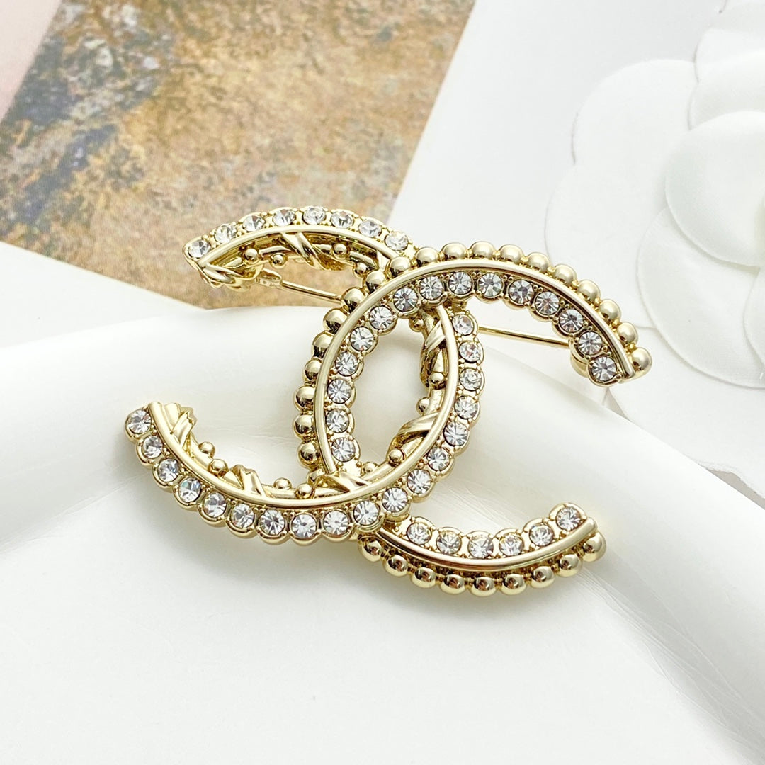 Double-C Emblem Brooch in Polished Metal-Tone – Design 062 detail view