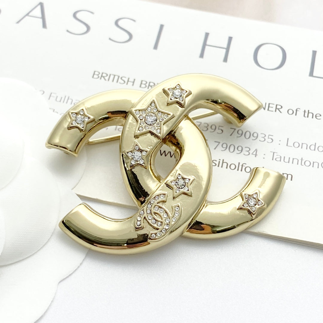 Double-C Emblem Brooch in Gold-Tone – Star Detail front product view