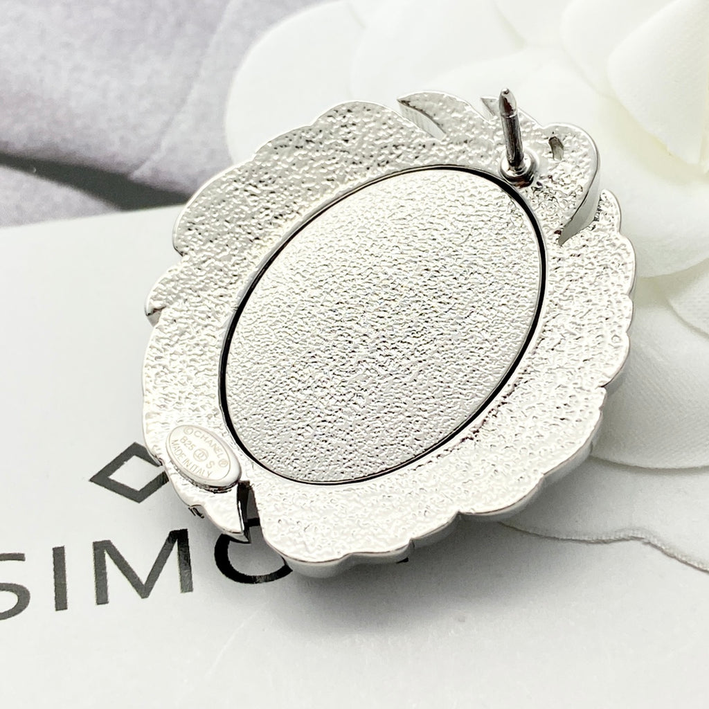 Signature Emblem Brooch in Black-Tone close-up detail