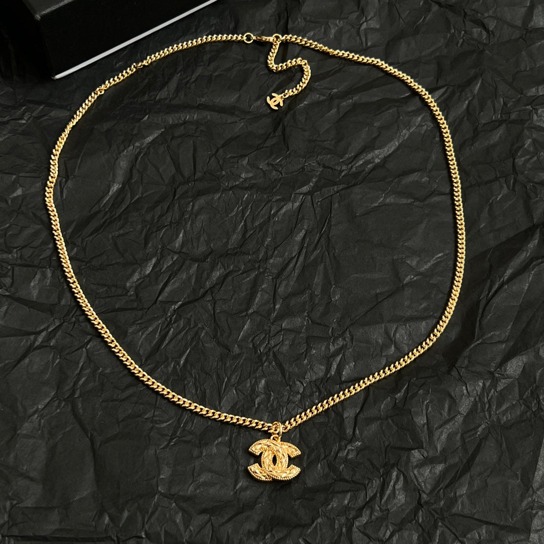 Double-C Emblem Pendant Necklace in Polished Metal-Tone – Design 063 close-up detail