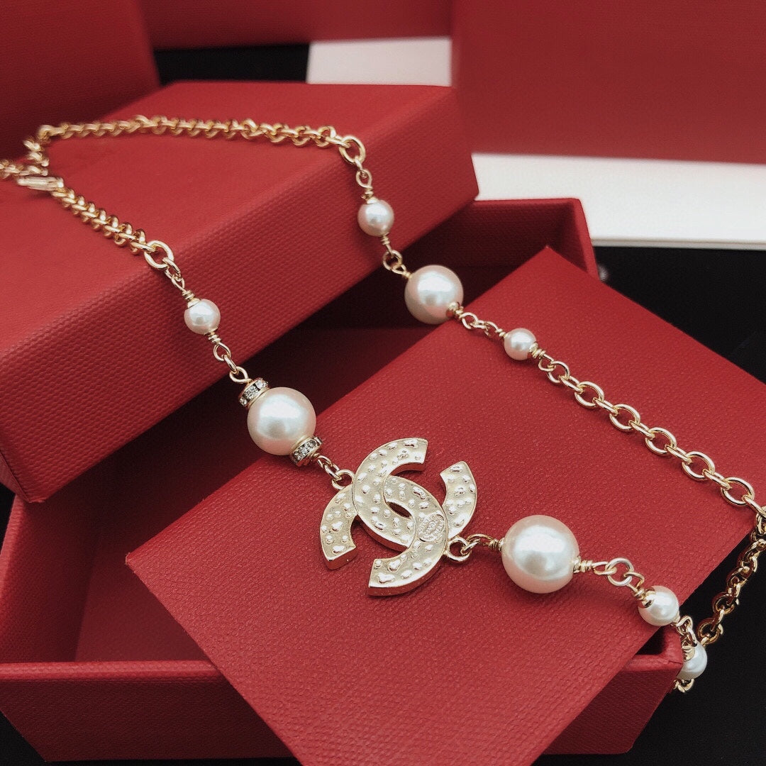Signature Emblem Pendant Necklace in Gold-Tone – Pink Detail – Design 005 styled product view
