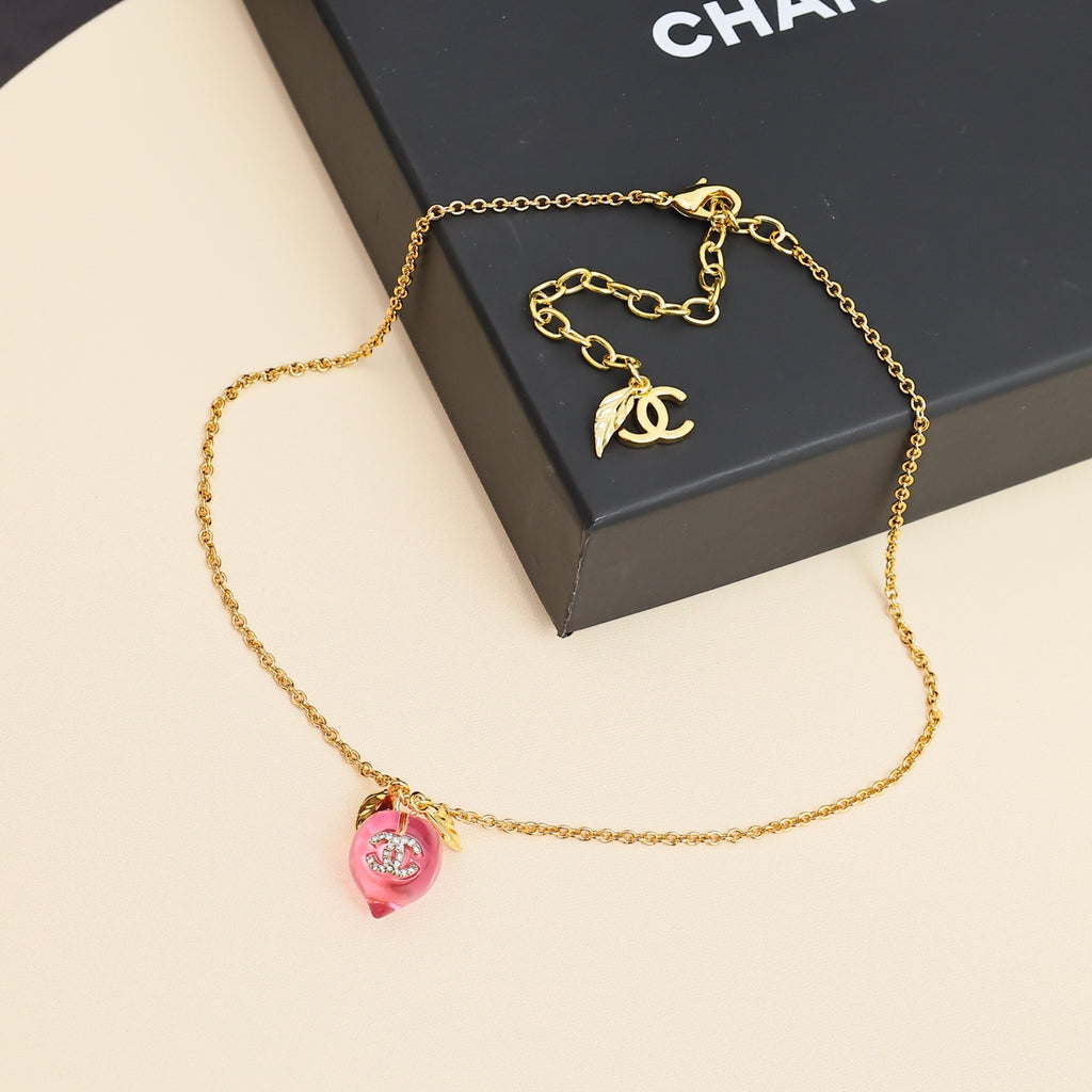 Signature Emblem Pendant Necklace in Polished Metal-Tone – Pink Detail front product view