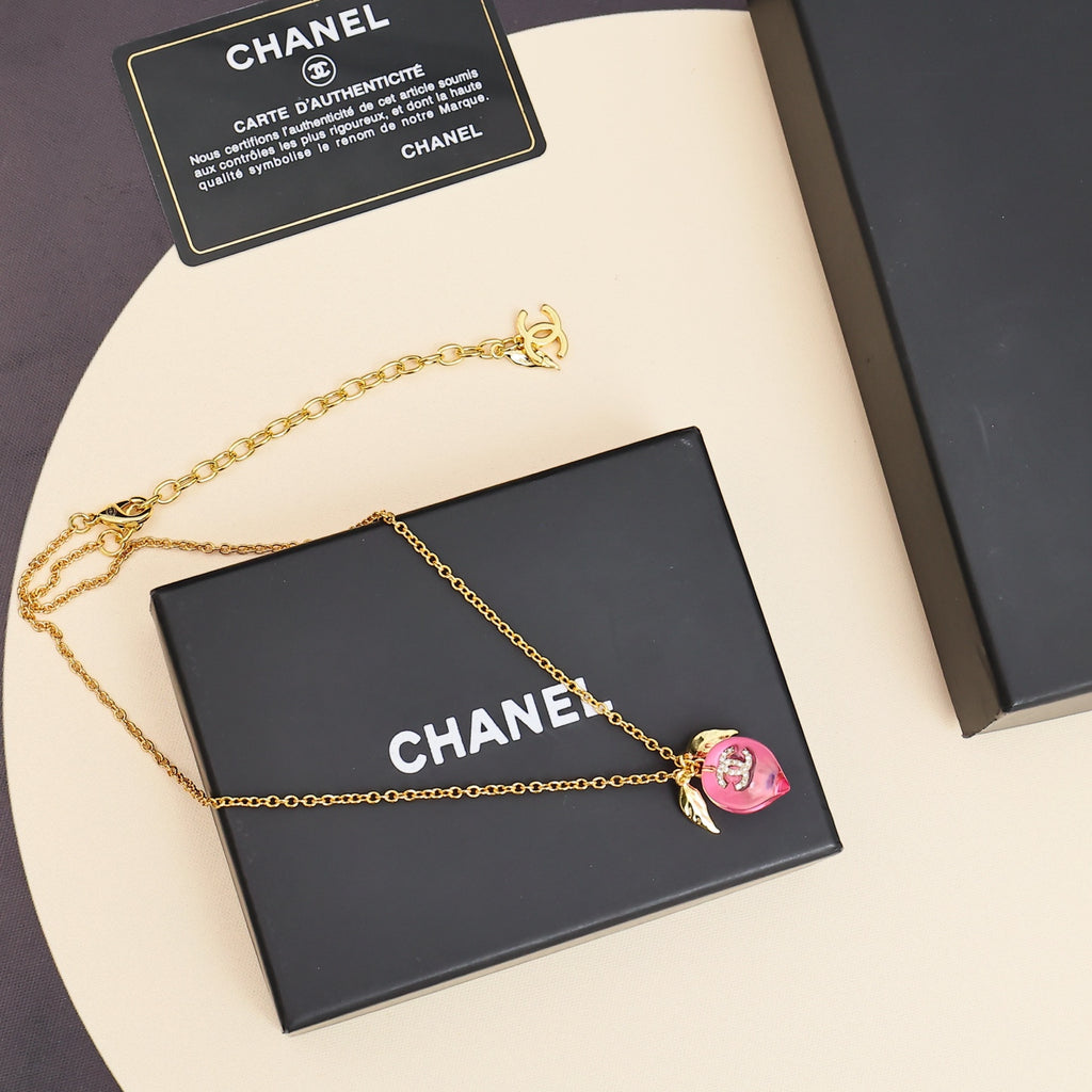 Signature Emblem Pendant Necklace in Polished Metal-Tone – Pink Detail styled product view