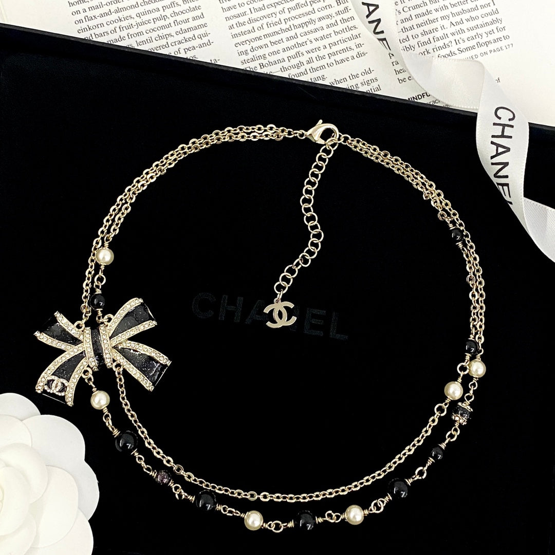Bow Pearl-Detail Pendant Necklace – Pearl Detail – Design 010 styled product view
