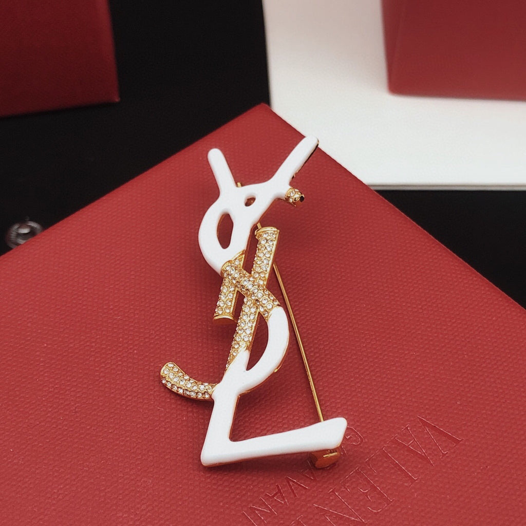Geometric Emblem Brooch in Gold-Tone – White Detail detail view