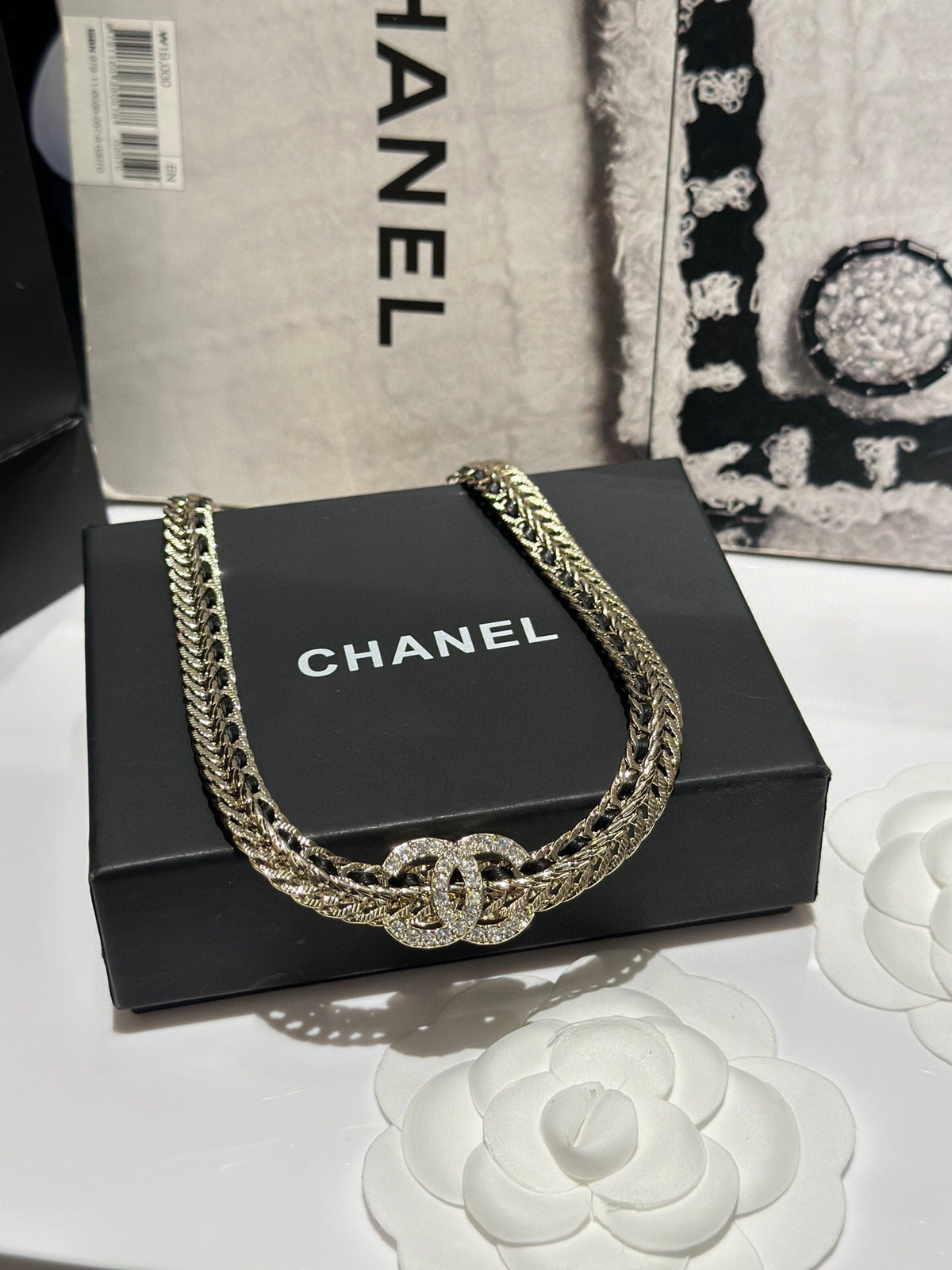 Signature Emblem Pendant Necklace in Polished Metal-Tone – Black Detail close-up detail