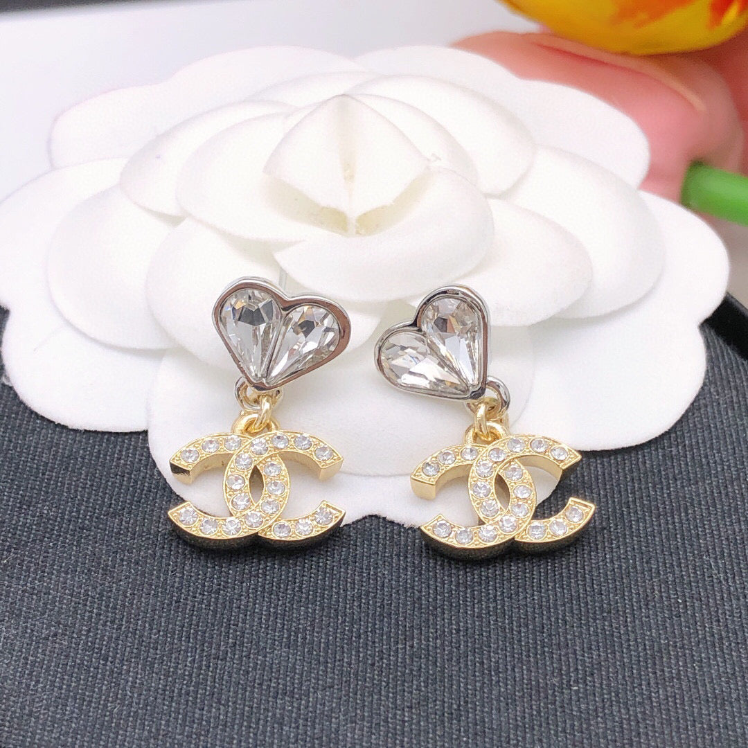 Double-C Emblem Jewelry Accessory in Gold-Tone – Heart Detail styled product view