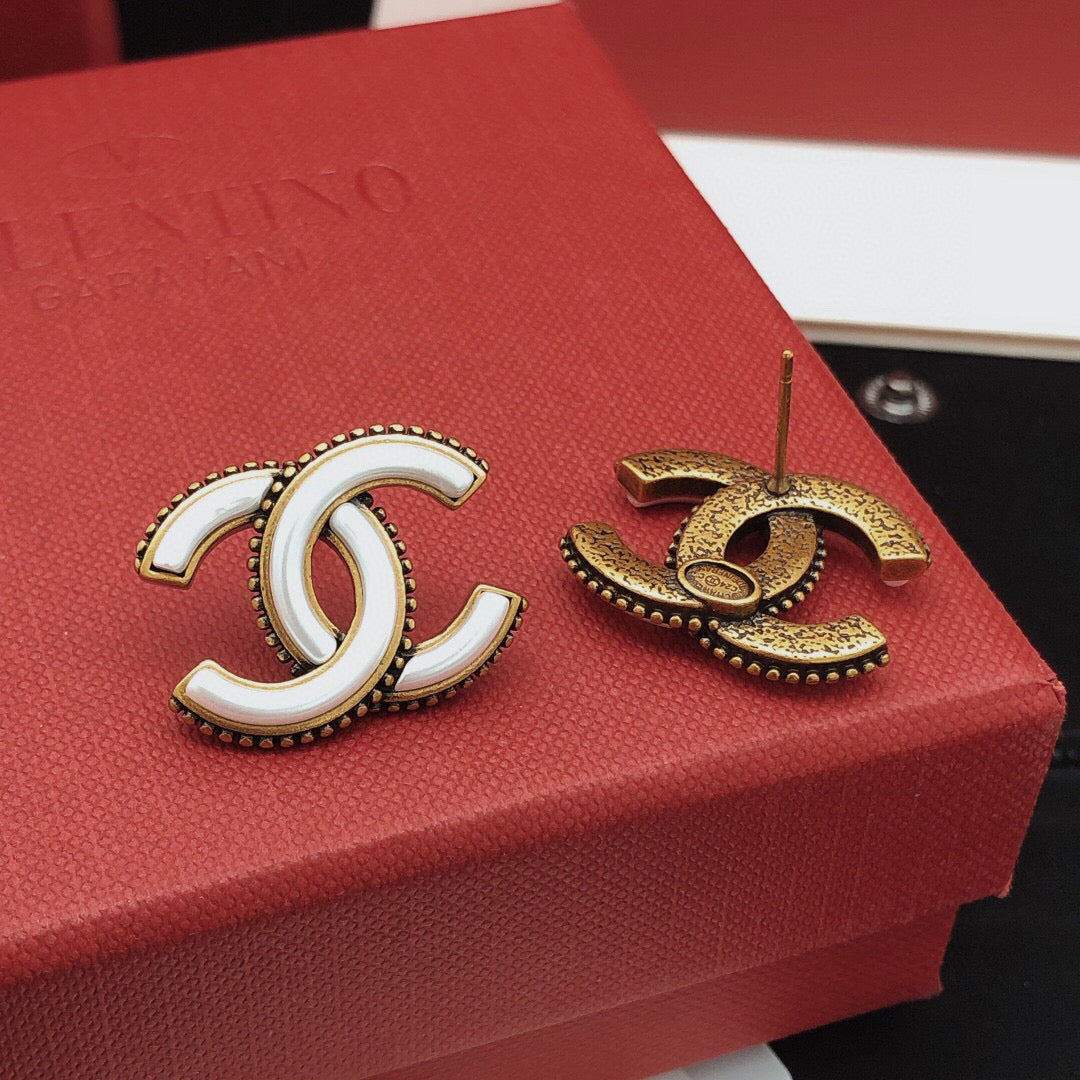 Double-C Emblem Stud Earrings in Gold-Tone – White Detail side detail
