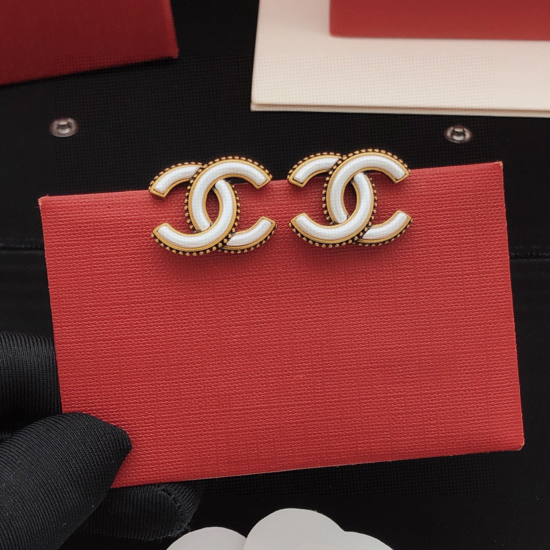 Double-C Emblem Stud Earrings in Gold-Tone – White Detail front product view