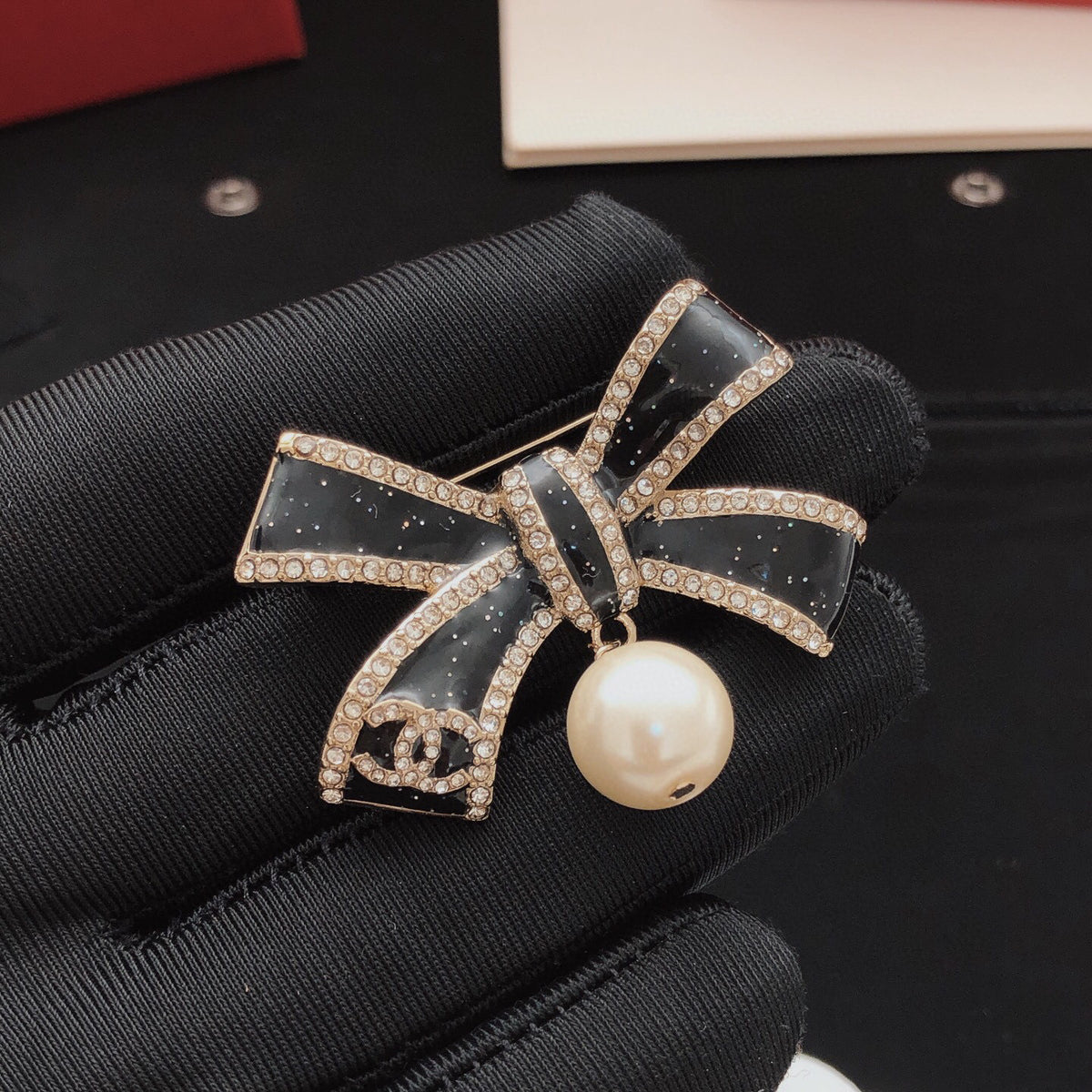 Bow Brooch in Gold-Tone – Black Detail front product view