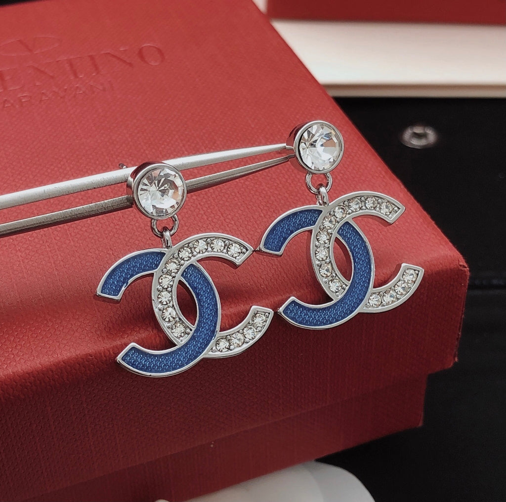 Signature Emblem Stud Earrings in Gold-Tone – Blue Detail styled product view