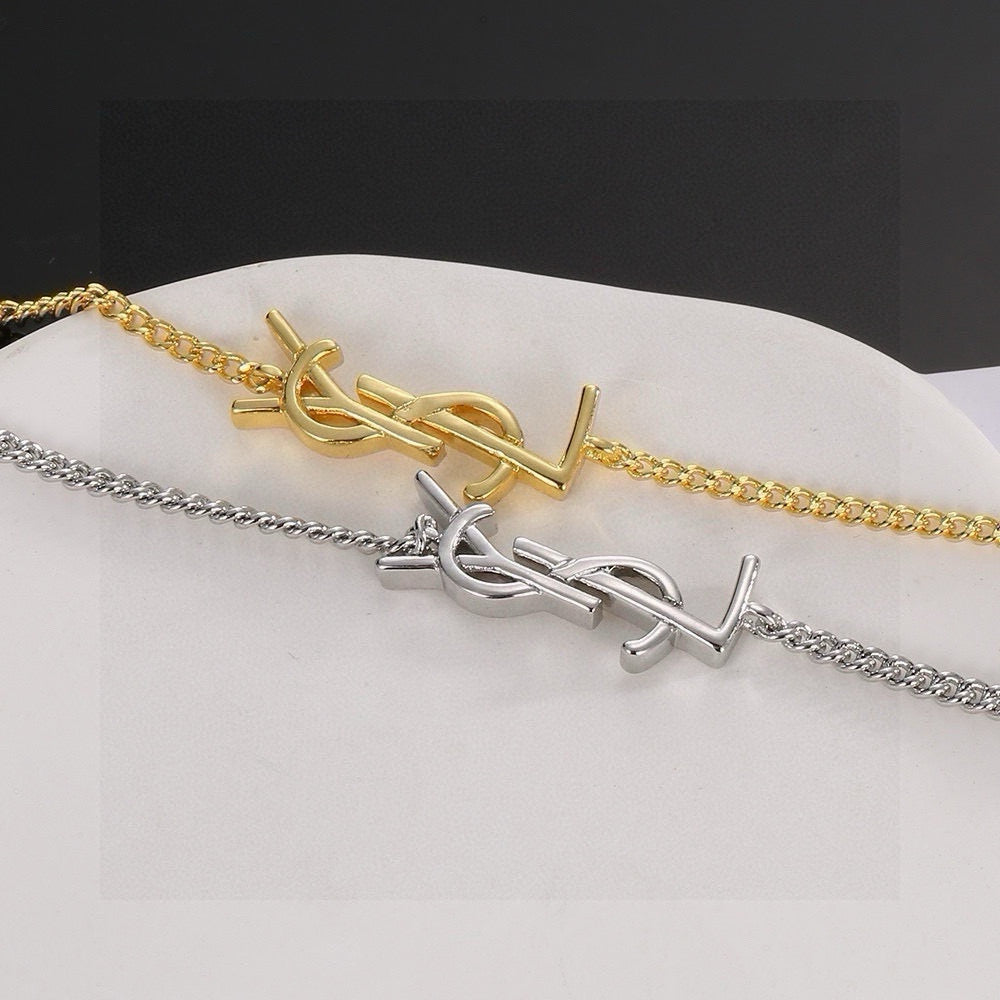 Geometric Emblem Bracelet in Polished Metal-Tone detail view