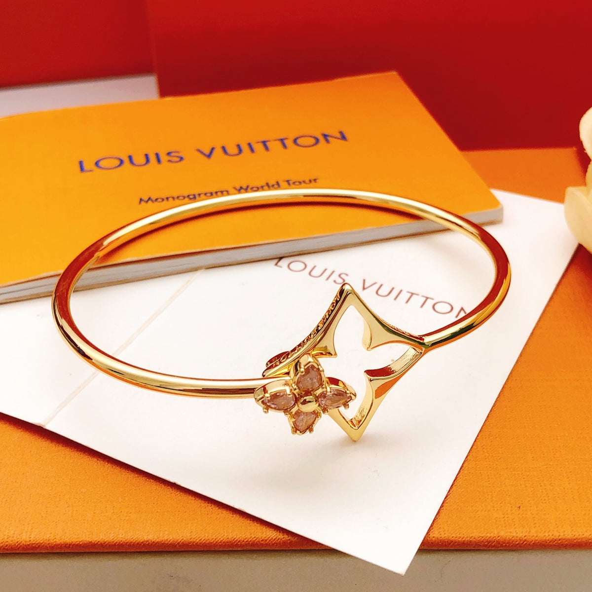 Geometric Emblem Bangle in Gold-Tone – Pink Detail styled product view