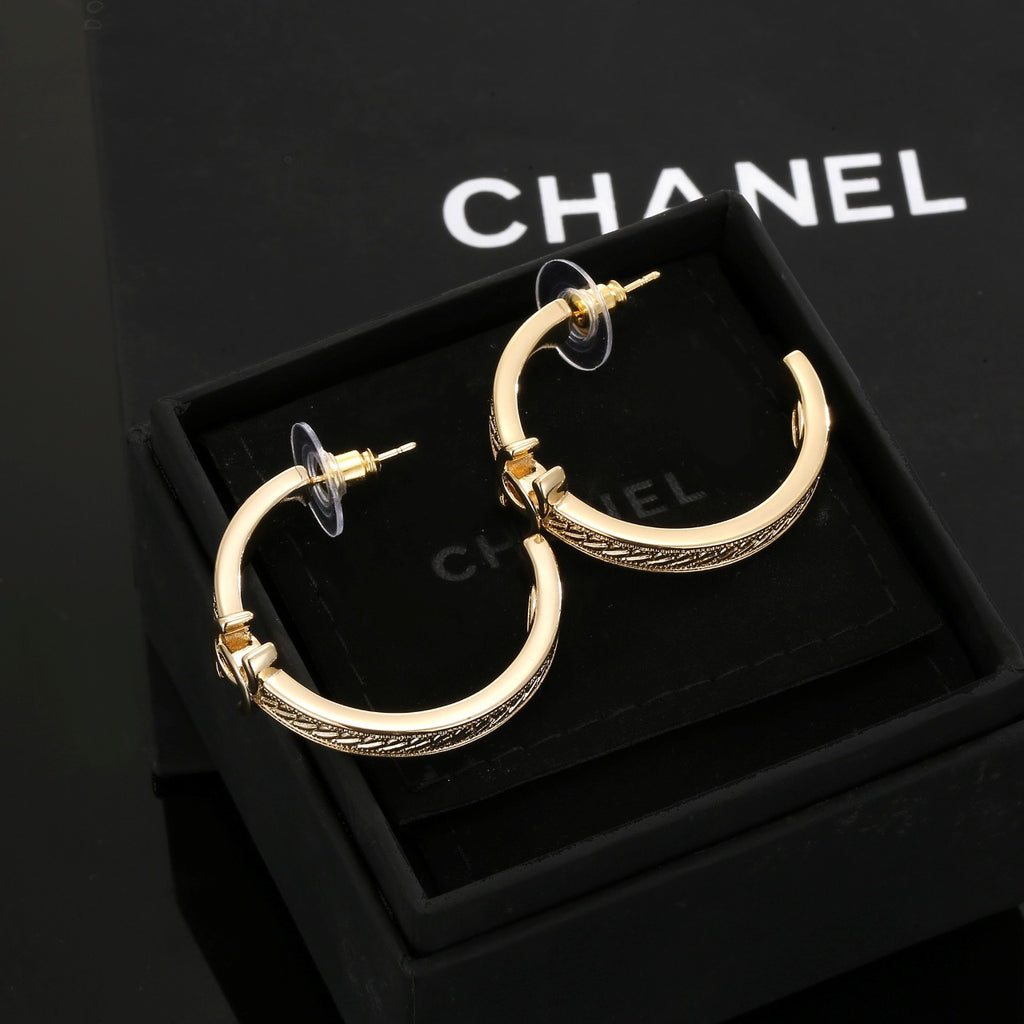 Signature Emblem Stud Earrings in Polished Metal-Tone – Design 018 detail view