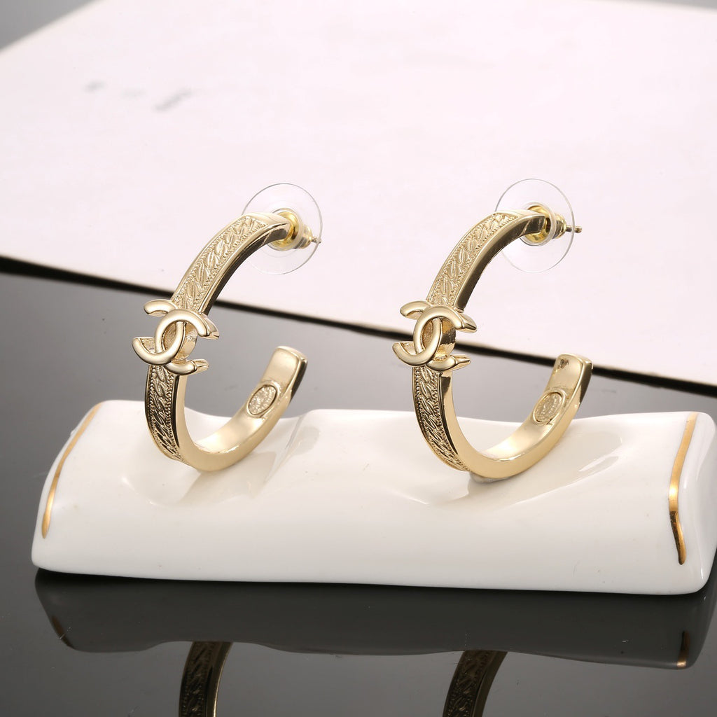 Signature Emblem Stud Earrings in Polished Metal-Tone – Design 018 styled product view
