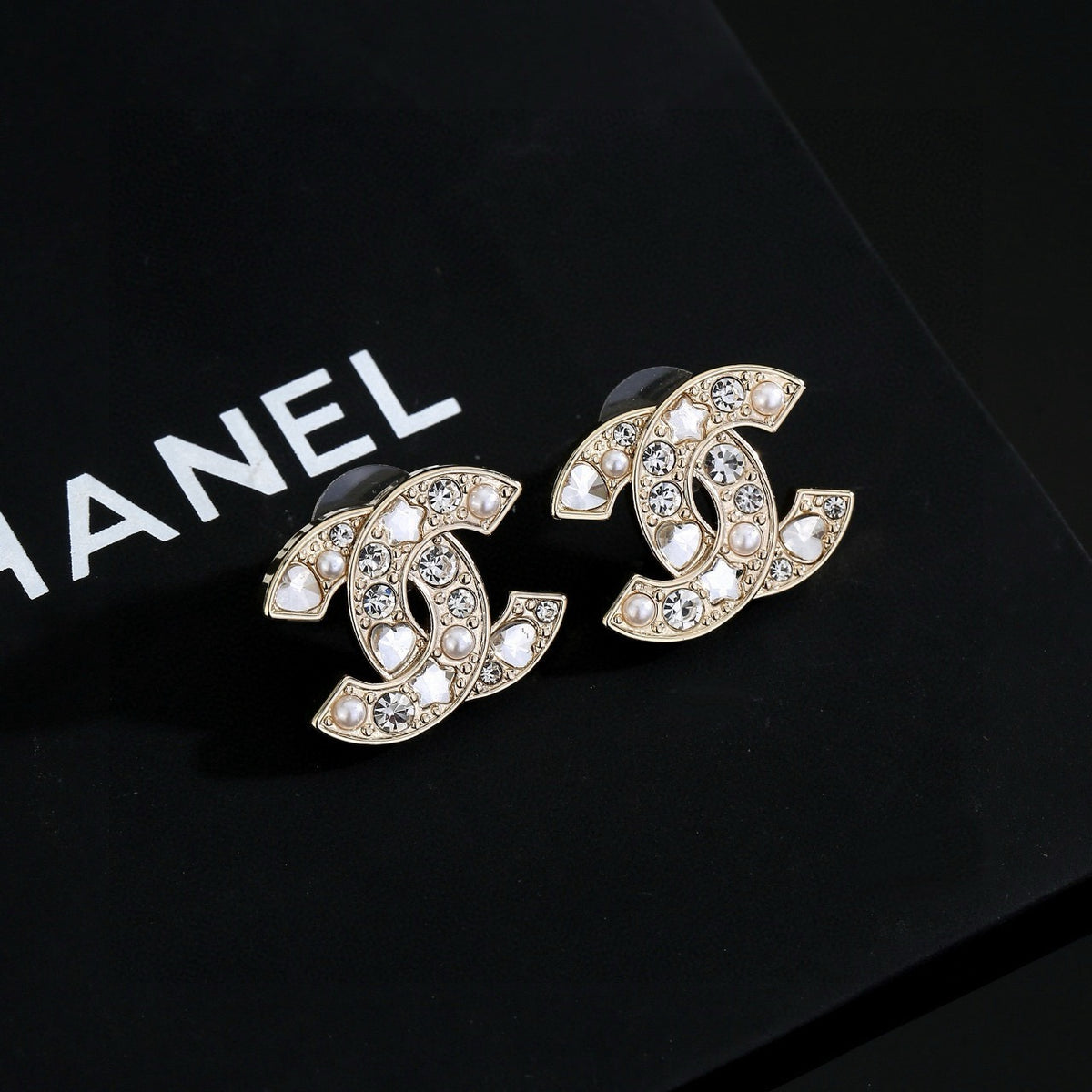 Double-C Emblem Stud Earrings in Gold-Tone – Star Detail – Design 004 detail view