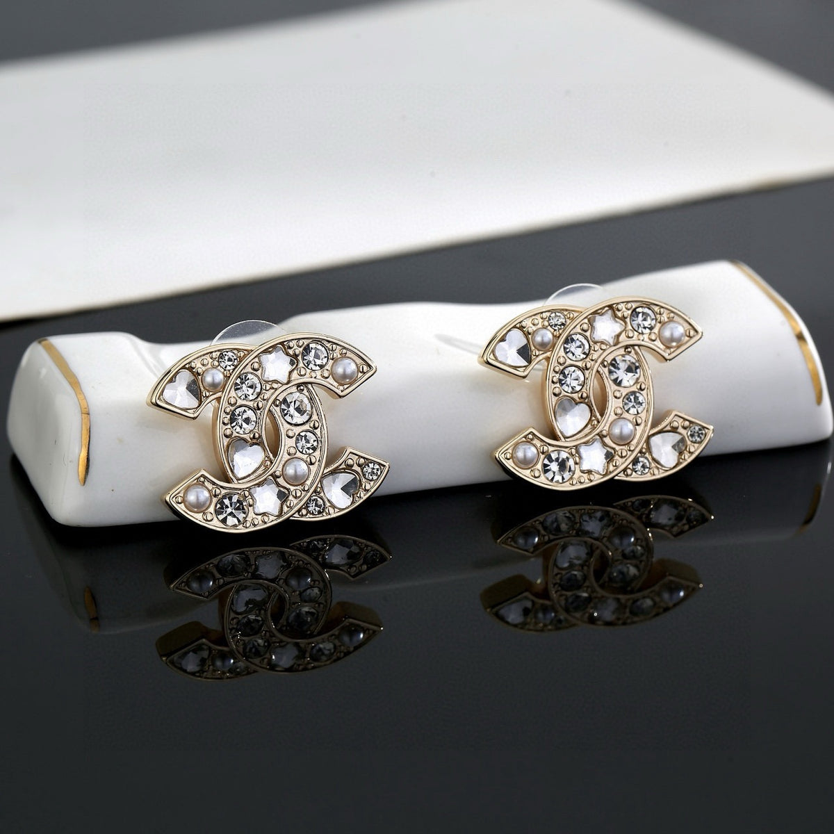 Double-C Emblem Stud Earrings in Gold-Tone – Star Detail – Design 004 side detail