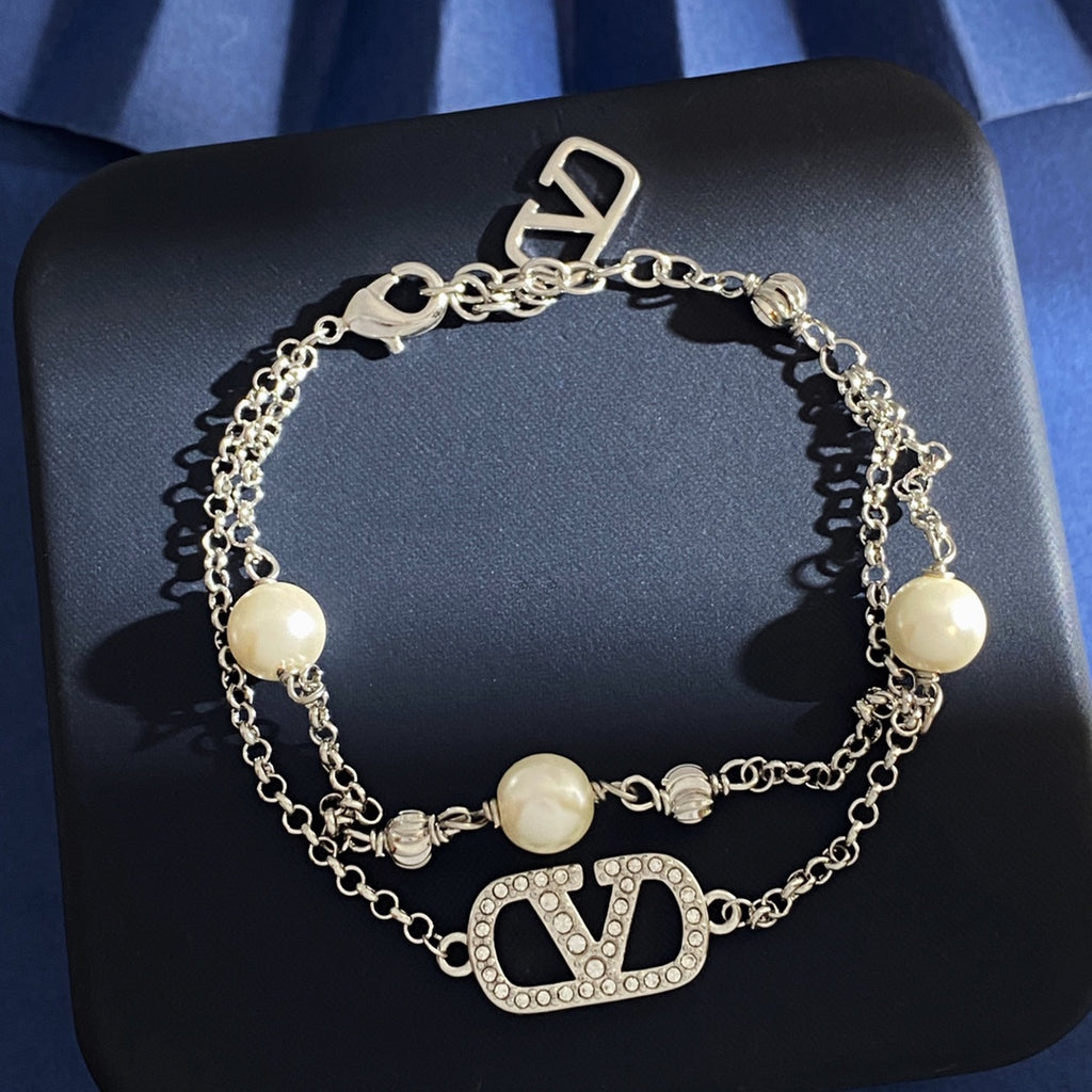 V Emblem Jewelry Accessory – White styled detail