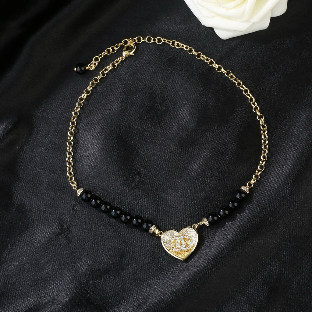 Double-C Emblem Pendant Necklace in Gold-Tone – Heart Detail main product view