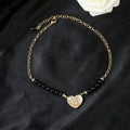 Double-C Emblem Pendant Necklace in Gold-Tone – Heart Detail main product view