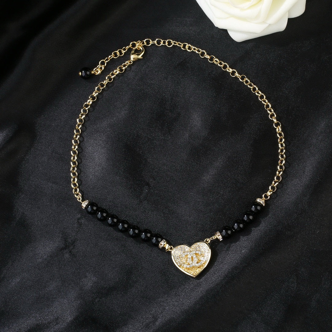 Double-C Emblem Pendant Necklace in Gold-Tone – Heart Detail main product view