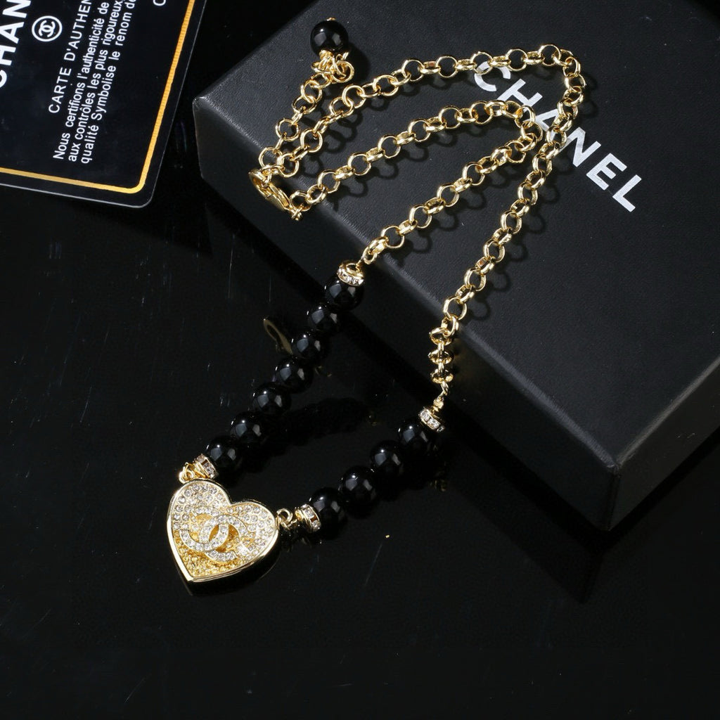 Double-C Emblem Pendant Necklace in Gold-Tone – Heart Detail front product view