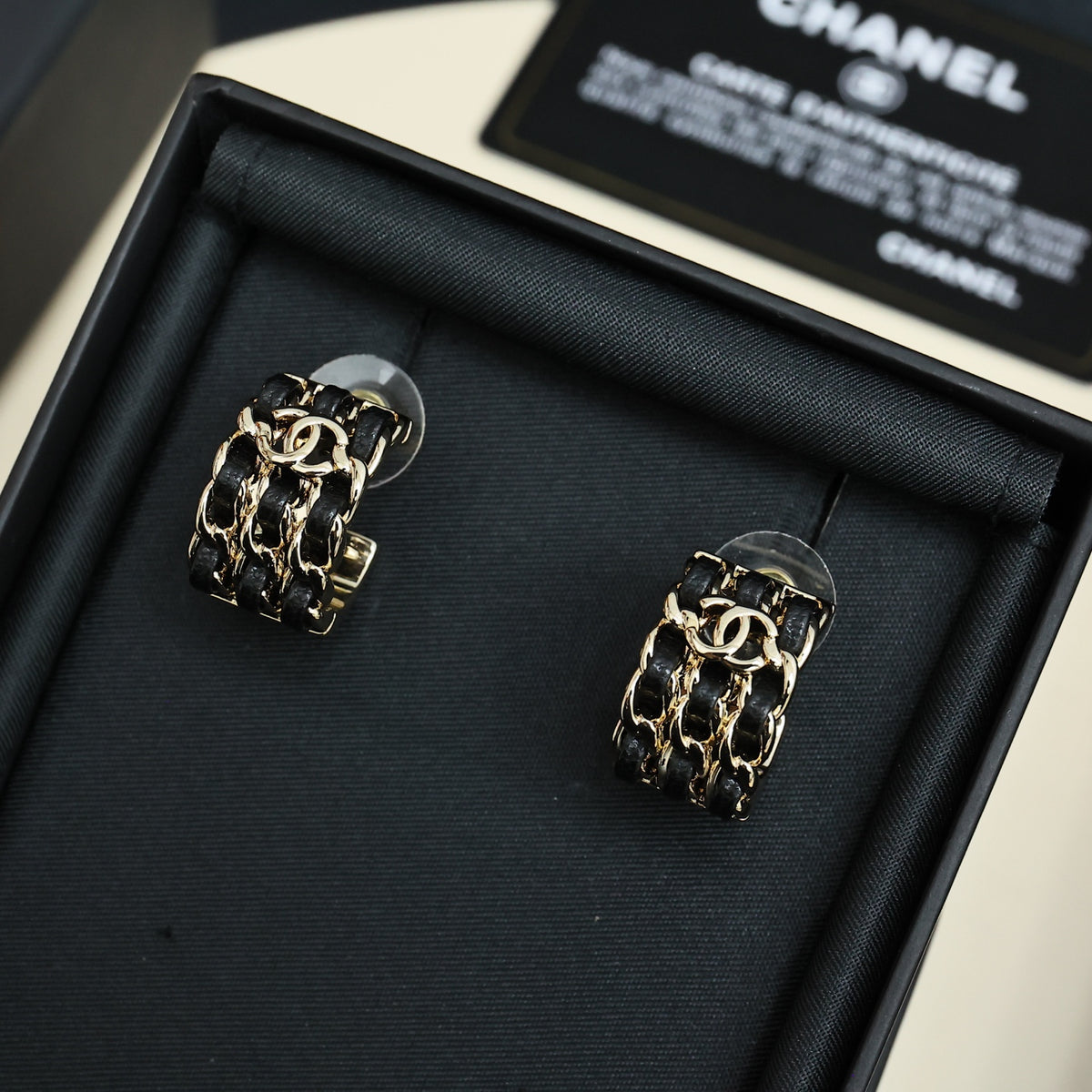 Double-C Emblem Stud Earrings in Gold-Tone – Black Detail – Design 002 detail view