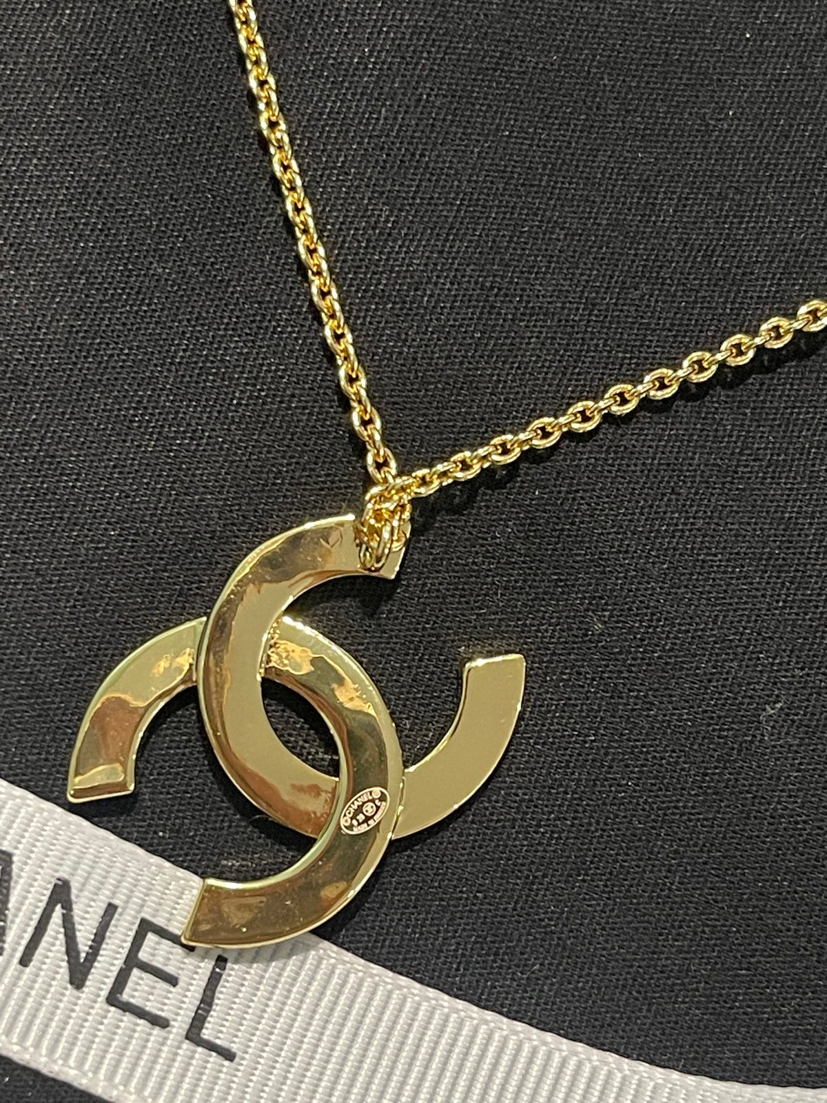 Double-C Emblem Pendant Necklace in Polished Metal-Tone – Design 043 close-up detail